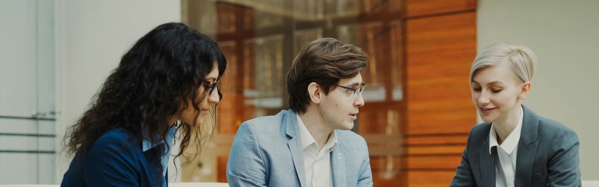 Professionals reviewing financial documents, like the business valuation methods appraisers use in a divorce