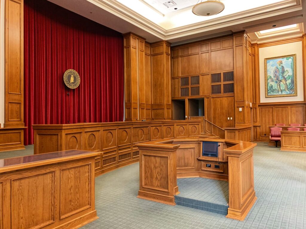 Empty wood-paneled courtroom with the bench, where a Snohomish County court commissioner hears divorce motions